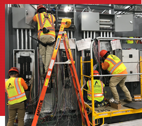 electricians working on a modular installation